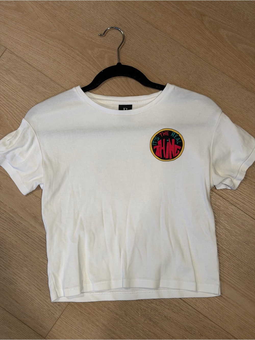 Realisations Par White Short Sleeve Tee with It’s The Real Thing Graphic